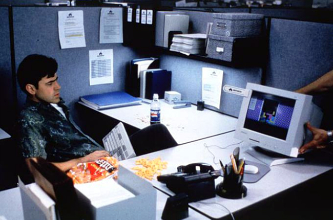 Peter Gibbons, from the 1999 movie Office Space, playing Tetris in his cubicle